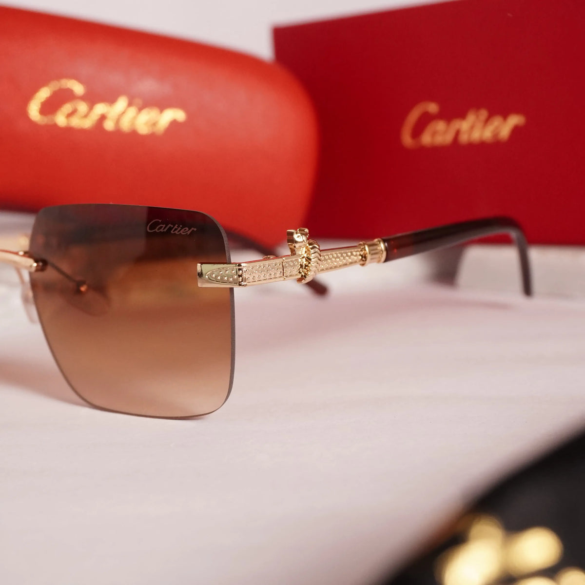 Rimless square gold brown gradient sunglasses - front flat lay showing full frame and gradient lenses
